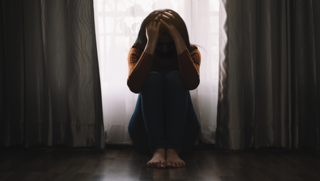 A person isolating herself following a breakup