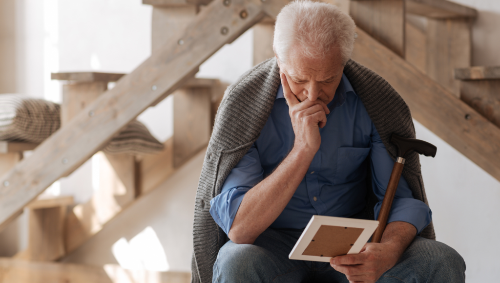 An old man mourning the loss of his wife